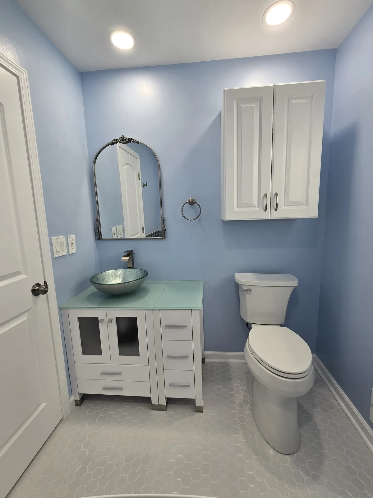 Finished: vessel-sink vanity, arched mirror and new toilet