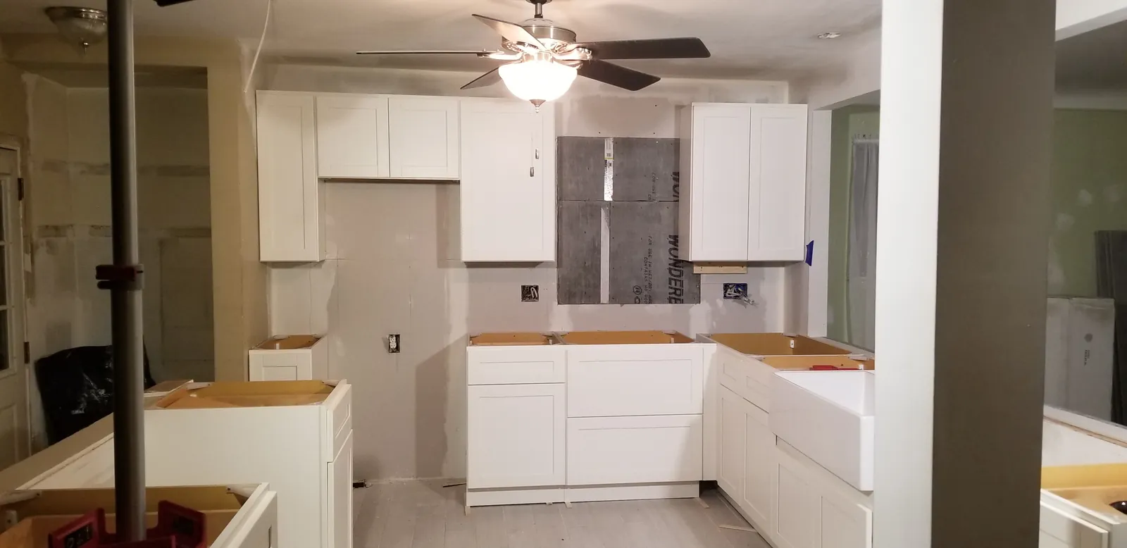 White shaker cabinets going in