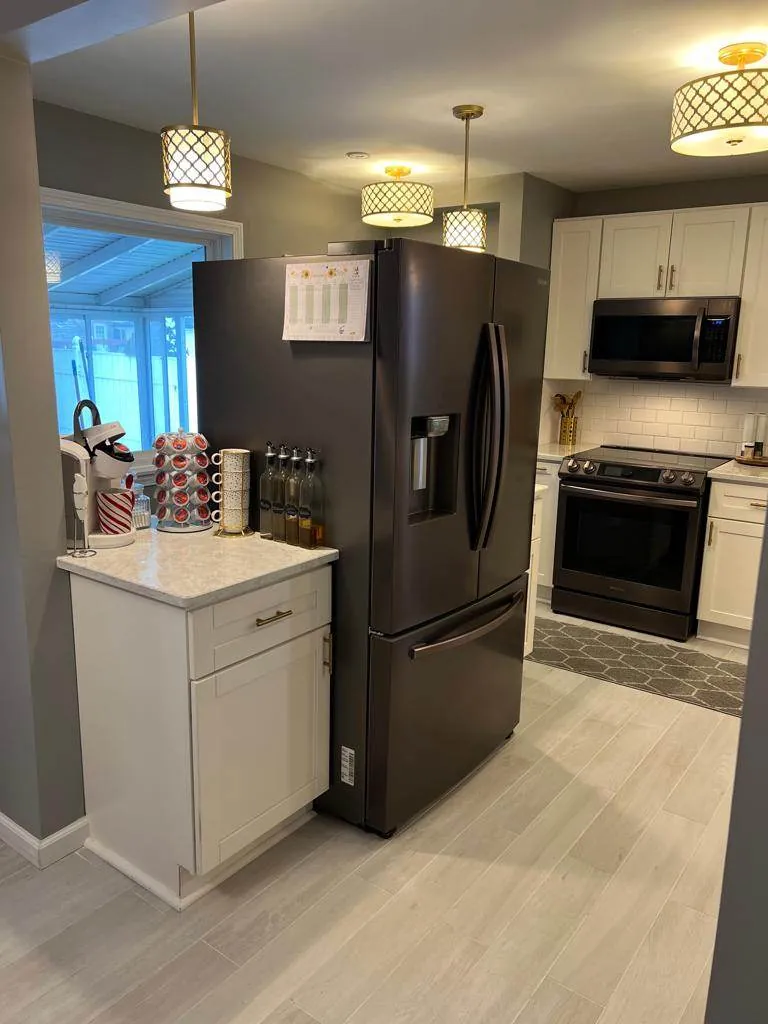 Finished: island seating and black appliances