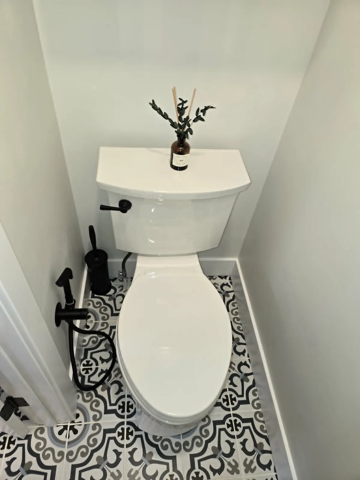 Finished: black fixtures against the patterned floor