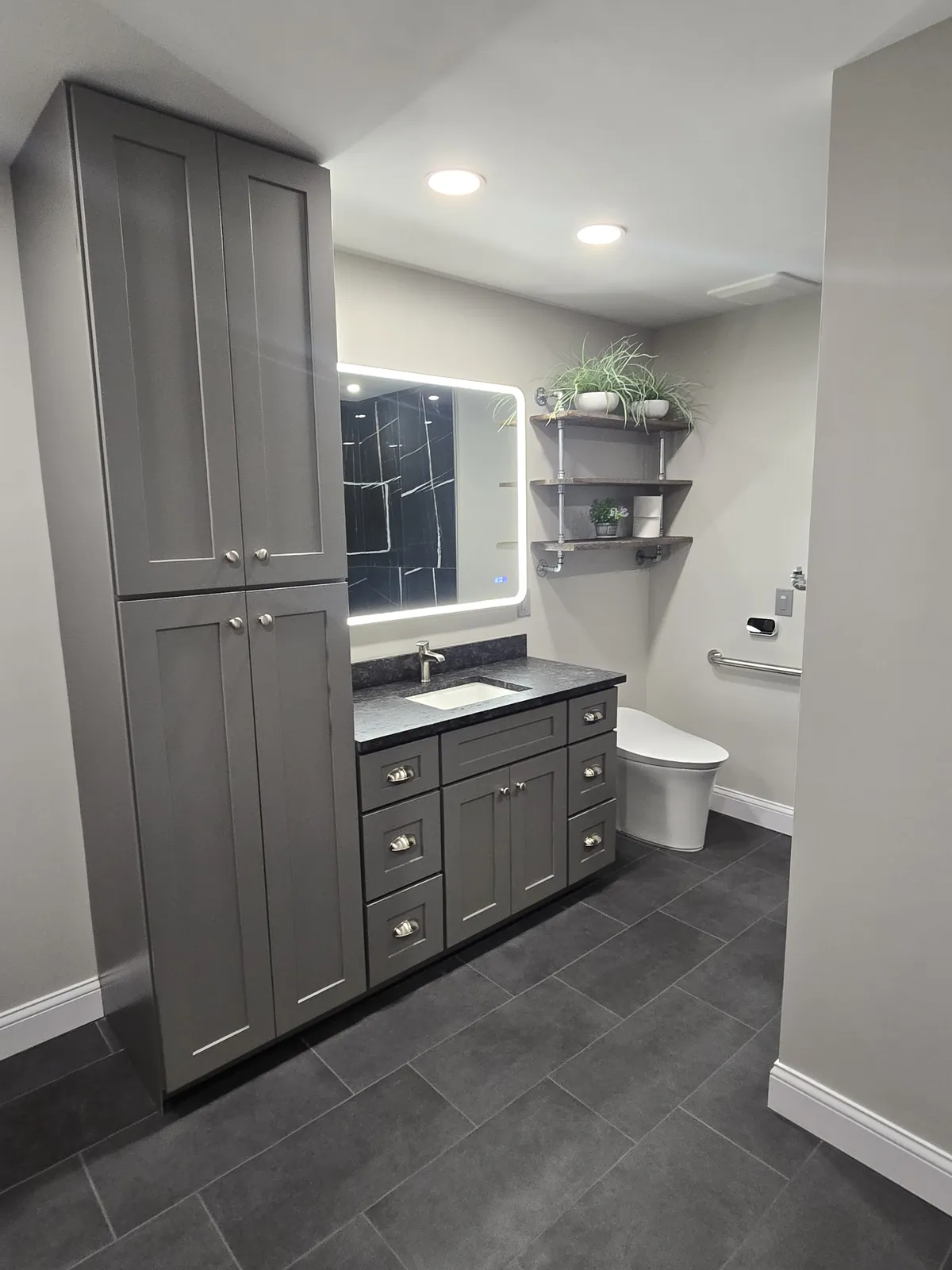Finished vanity with LED mirror and storage tower