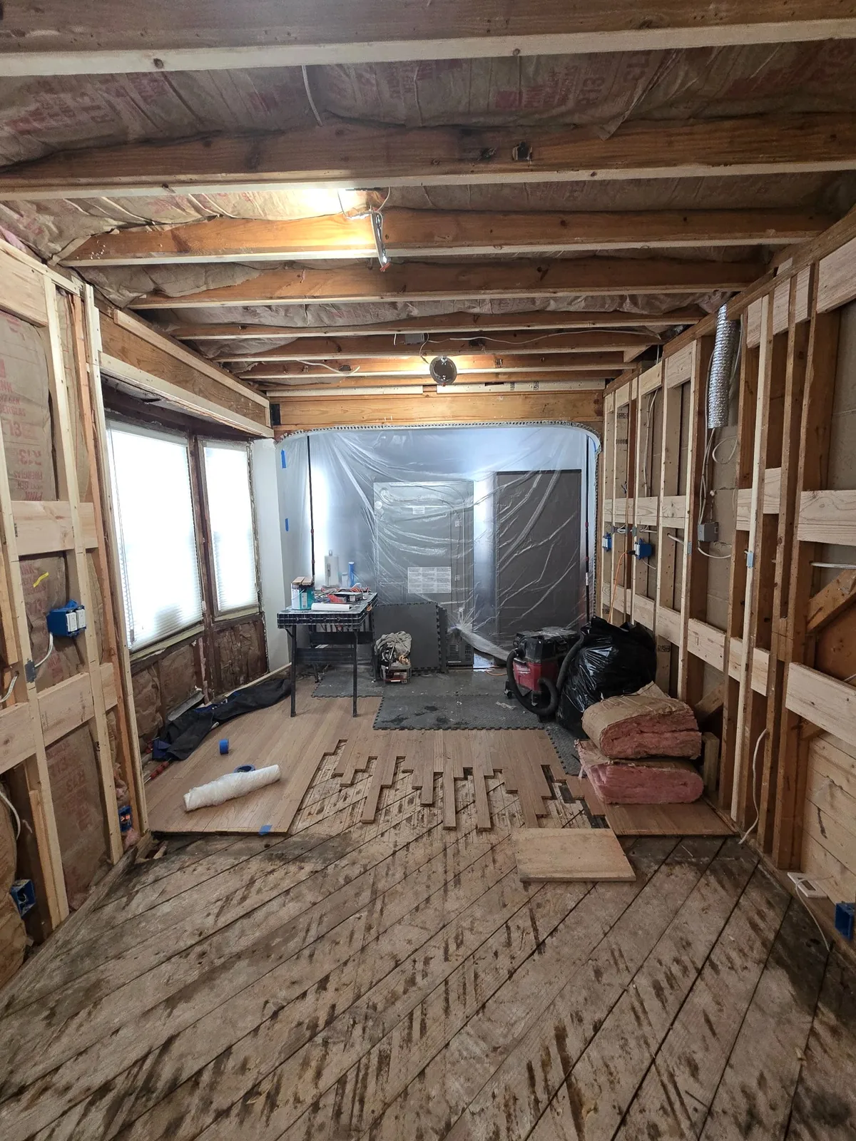 Gutted to the studs: walls open, floor coming out