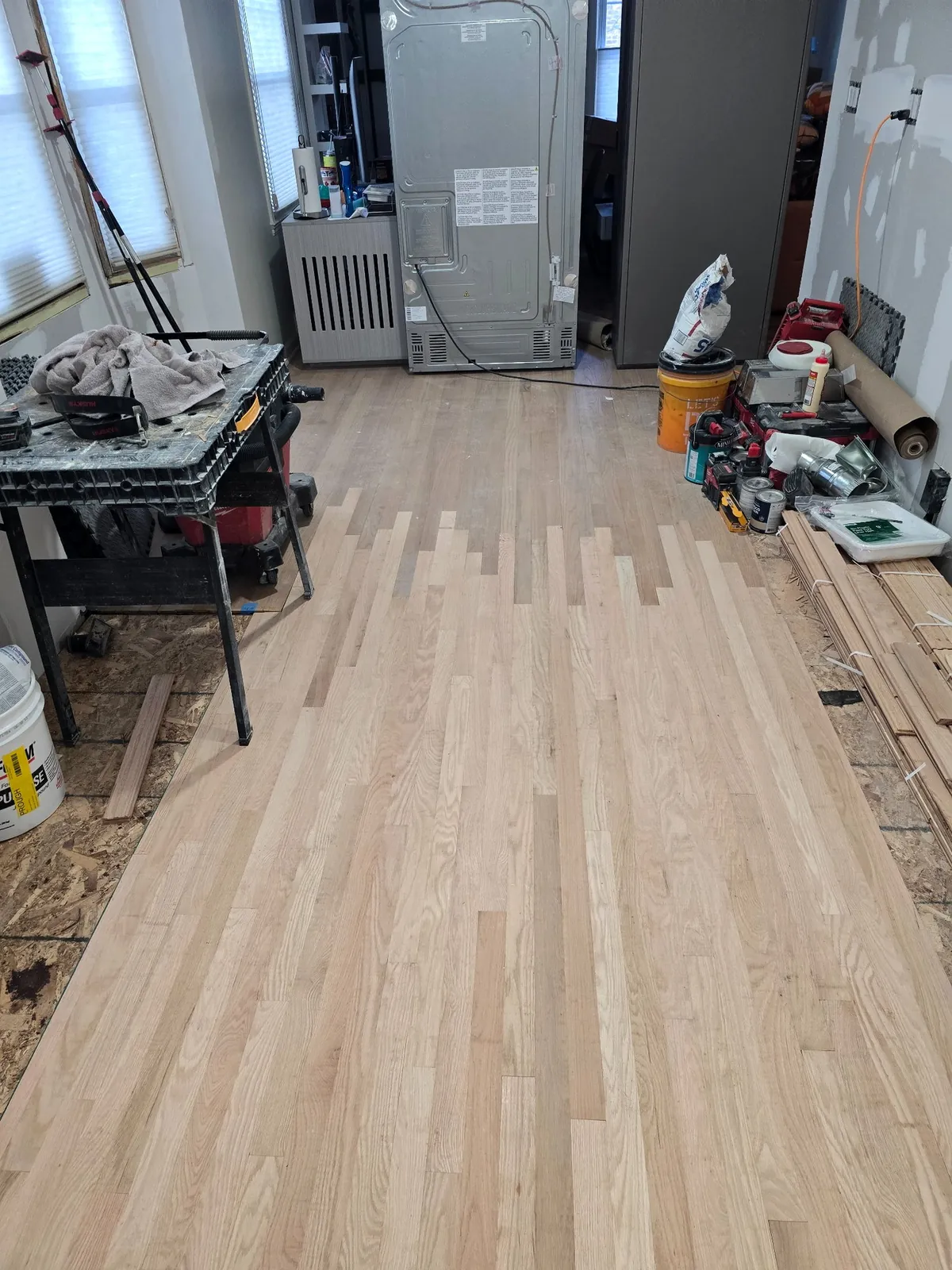New oak flooring laced into the original