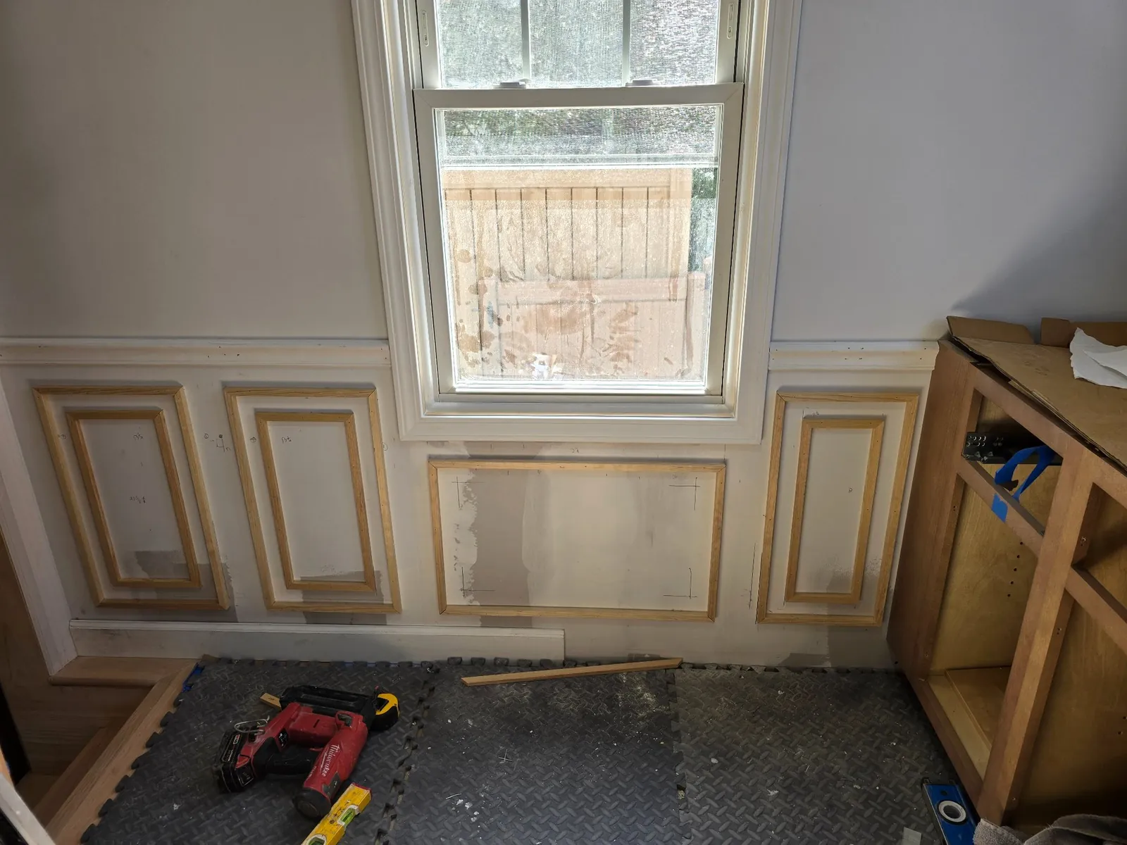 Wainscoting rebuilt and cabinets staged