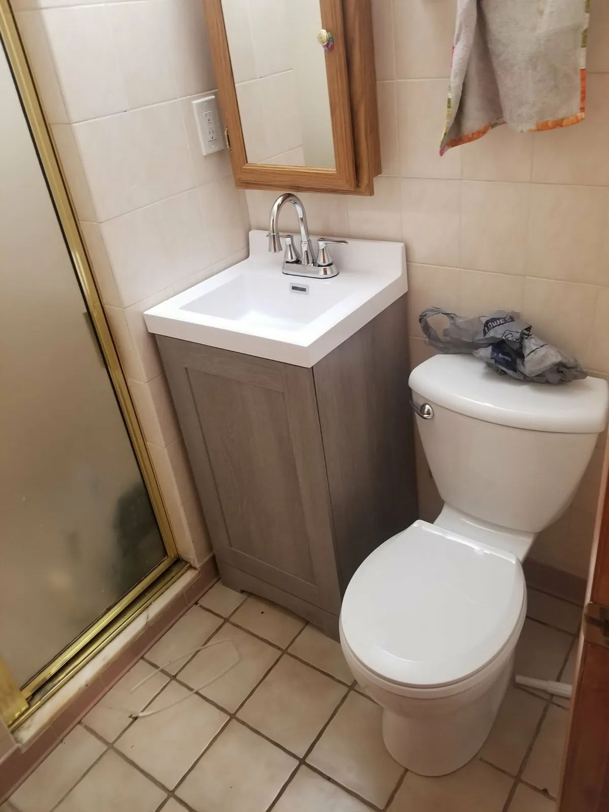 Before: the original pink 1960s tile bathroom
