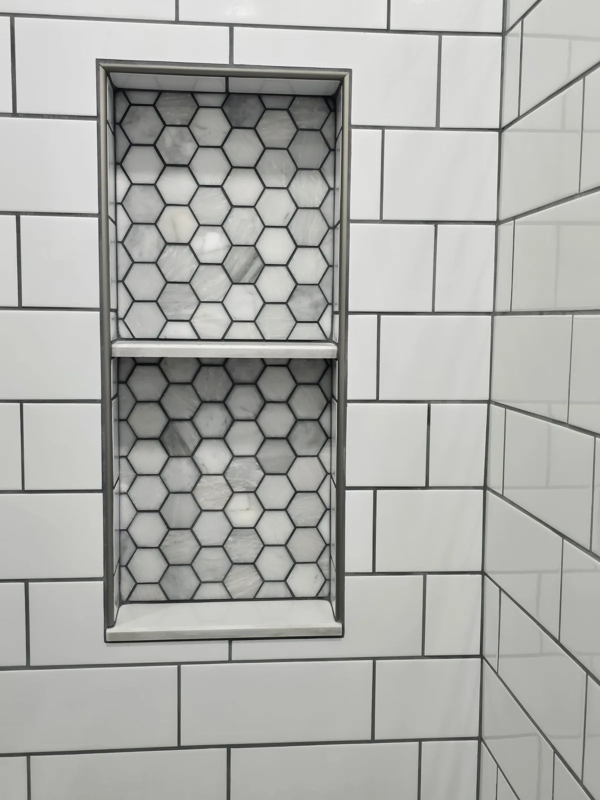 Finished: subway tile shower with hex mosaic niche