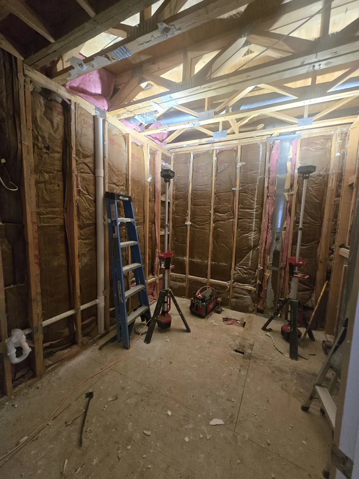 Taken to the studs: framing, fresh insulation and new blocking