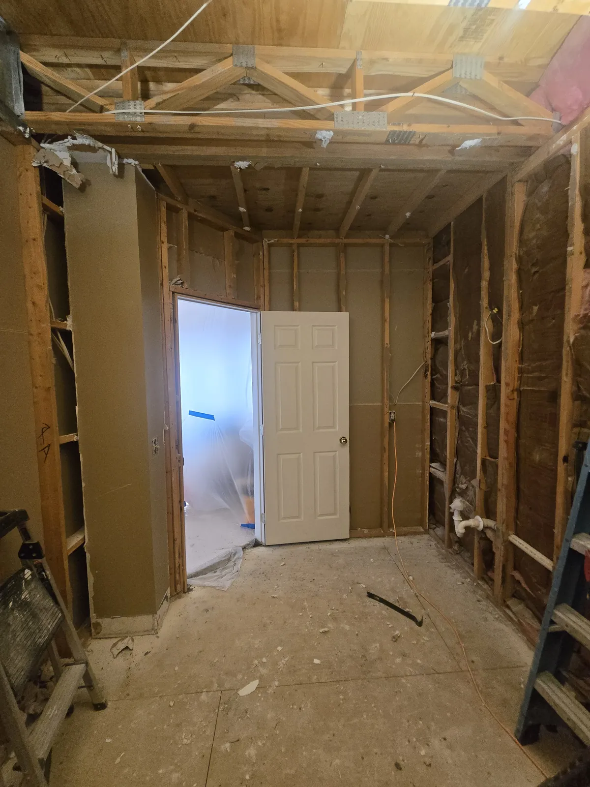 Studs-out demo, looking toward the new doorway