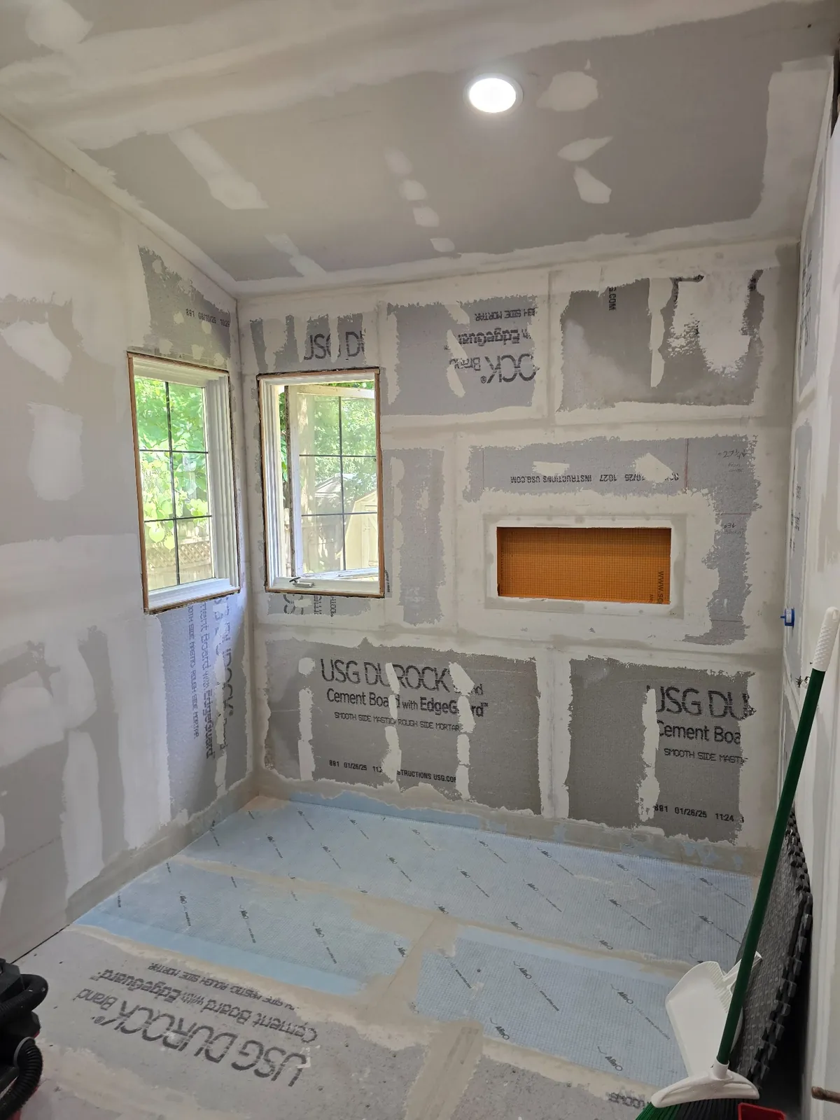 Cement board, curb and shower niche framed and ready for waterproofing
